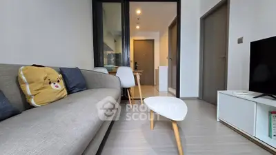 Modern living room with cozy sofa and stylish decor in a contemporary apartment.