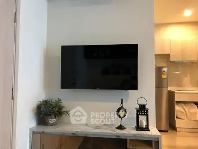 Modern living room with wall-mounted TV and stylish decor