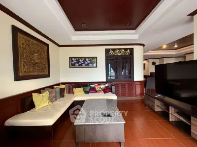 Spacious living room with elegant decor and modern furnishings in a luxurious apartment.
