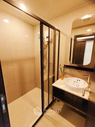 Modern bathroom with sleek shower enclosure and stylish vanity