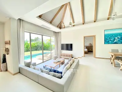 Luxurious living room with pool view and modern decor