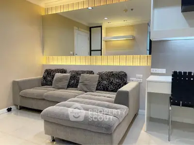 Modern living room with stylish sofa and elegant lighting, perfect for relaxation and entertaining.