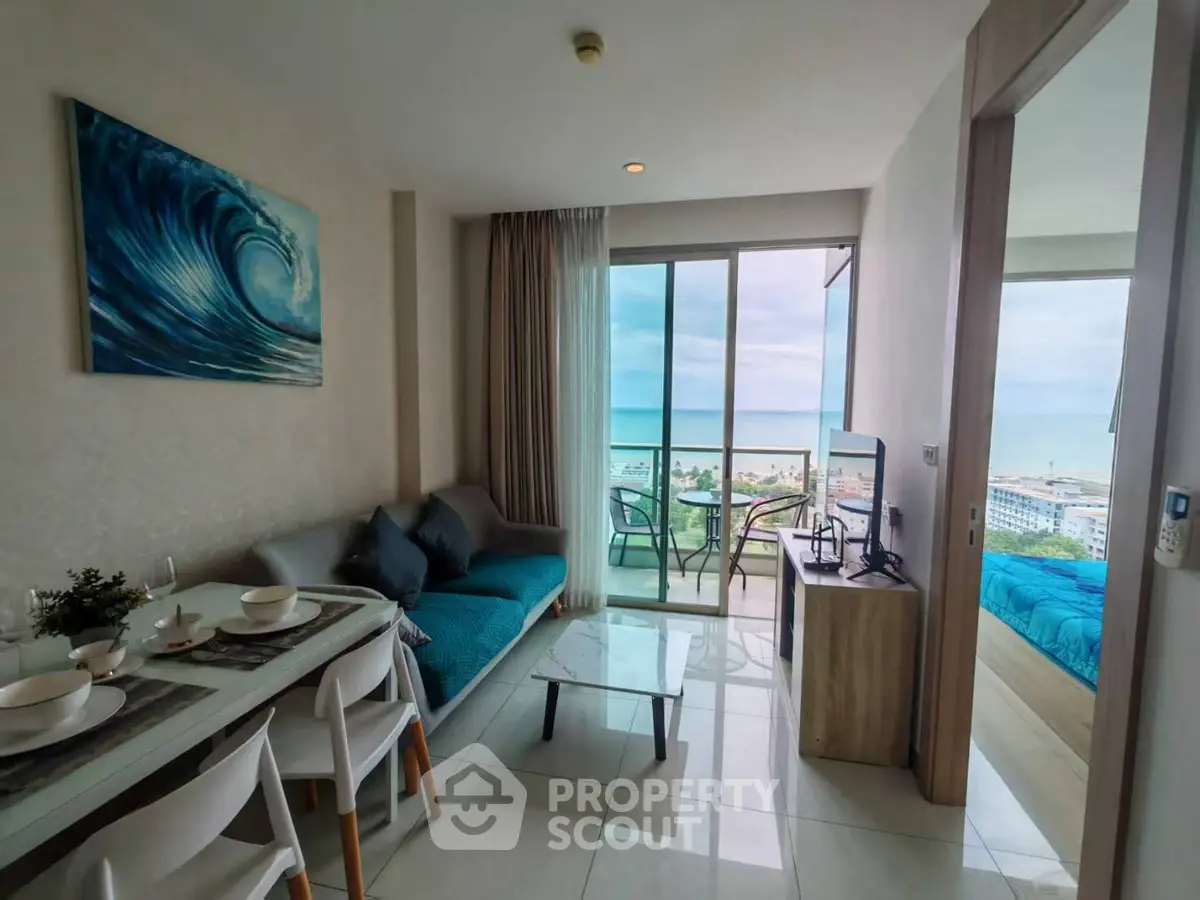 Modern living room with ocean view and balcony access in a stylish apartment