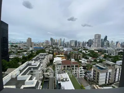 Stunning cityscape view from high-rise balcony overlooking urban skyline.