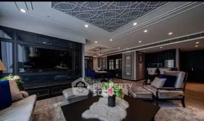 Luxurious living room with elegant decor and spacious layout, featuring modern furniture and stylish ceiling design.