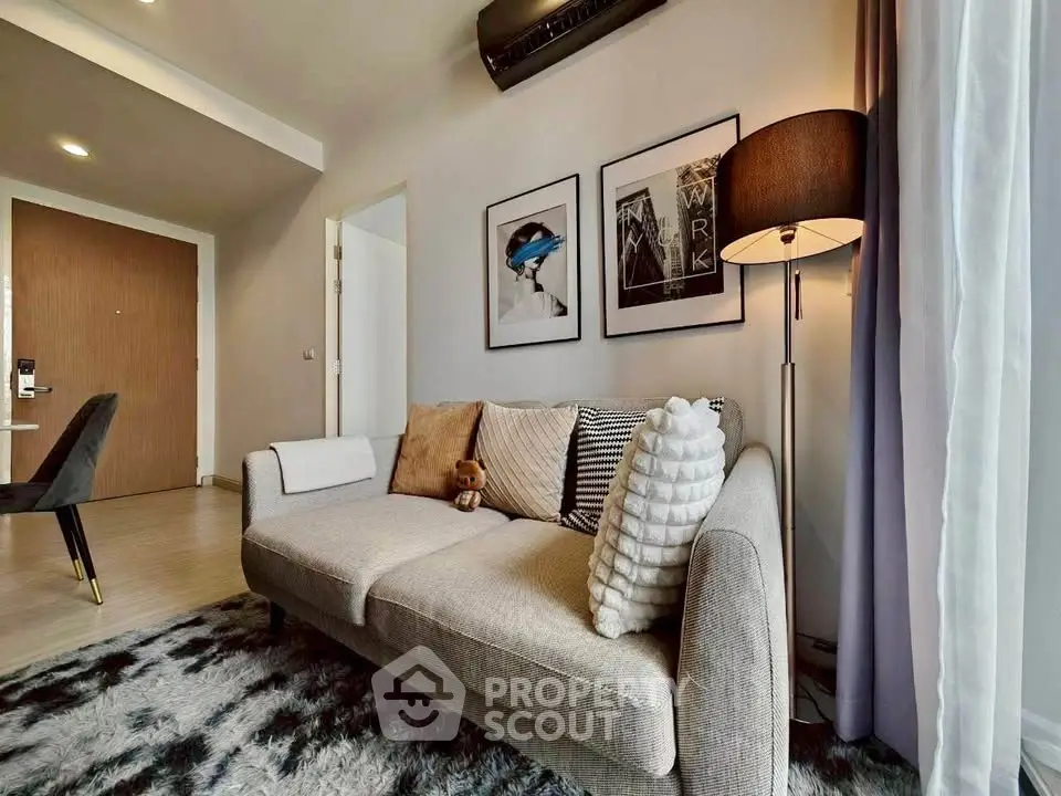 Stylish living room with modern decor and cozy sofa in a contemporary apartment.