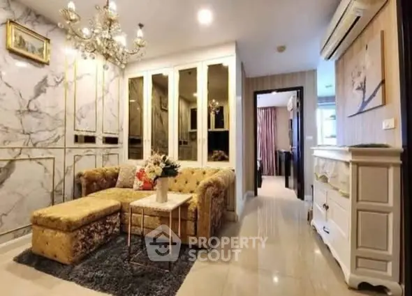 Luxurious living room with elegant decor and plush seating in a modern apartment.