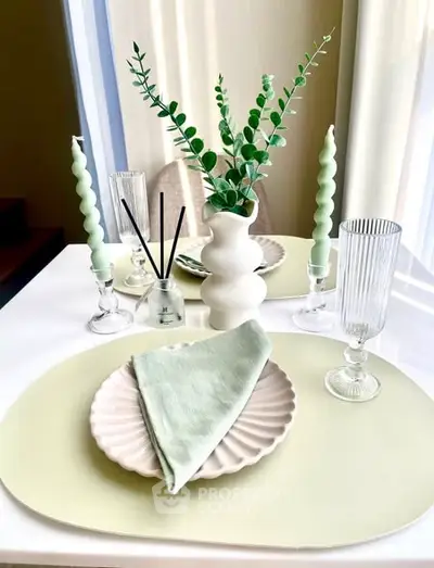 Elegant dining table setup with modern decor and soft pastel tones.