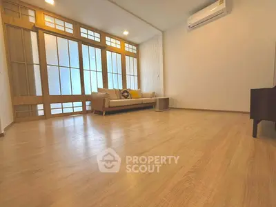 Spacious living room with wooden flooring and modern decor