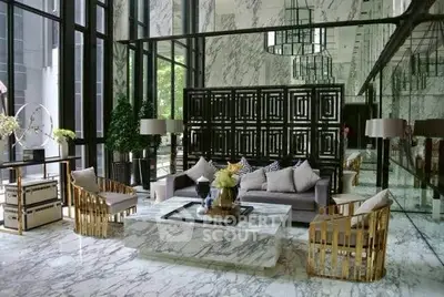 Luxurious marble-floored living room with elegant decor and large windows.