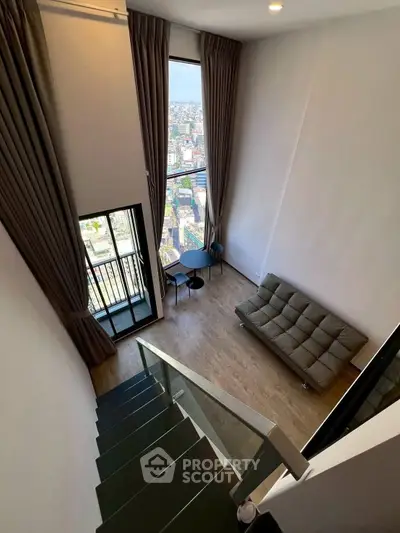 Modern living room with large windows and stylish decor