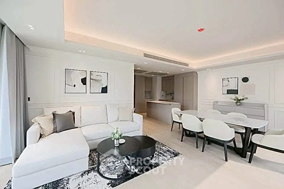 Luxurious modern living room with open kitchen and elegant dining area