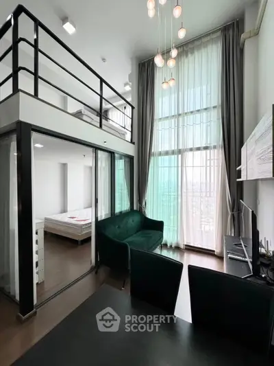 Modern loft apartment with high ceilings and mezzanine bedroom, featuring stylish furniture and large windows.