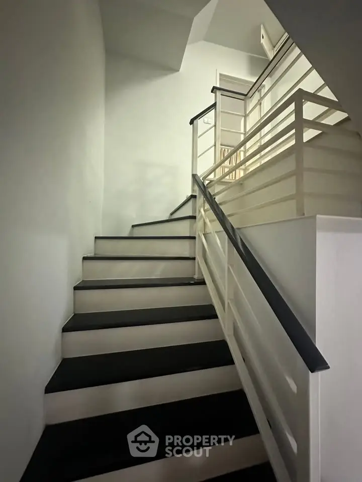 Modern staircase with sleek railing in a contemporary building