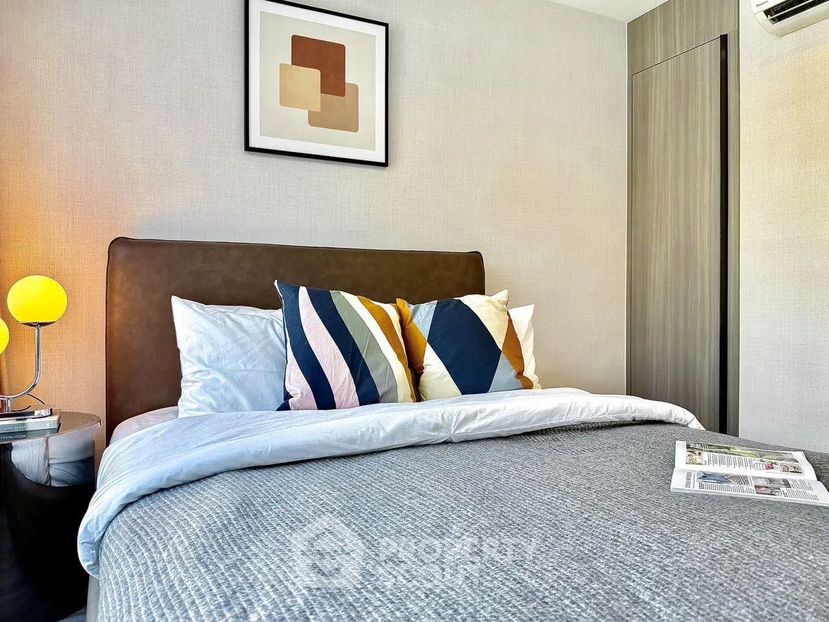 Cozy modern bedroom with stylish decor and colorful pillows