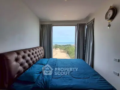 Luxurious bedroom with stunning ocean view and elegant decor