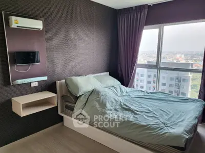 Modern bedroom with city view, featuring a cozy bed and wall-mounted TV.
