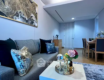Modern living room with elegant decor and dining area in a stylish apartment
