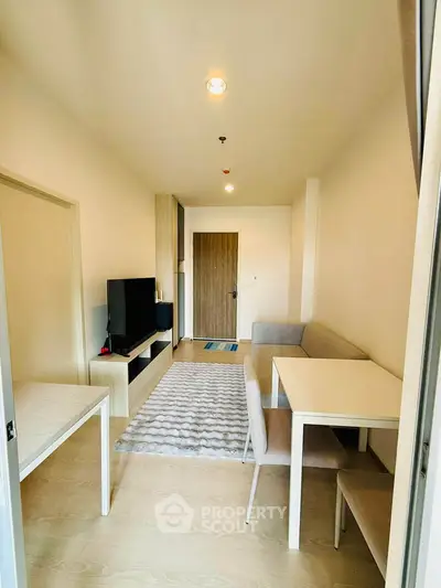 Modern living room with stylish furniture and natural light, perfect for cozy gatherings.