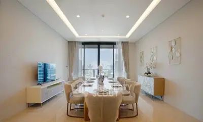 Luxurious dining room with elegant decor and stunning city view, perfect for entertaining guests.