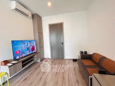 Modern living room with sleek TV setup and stylish furniture