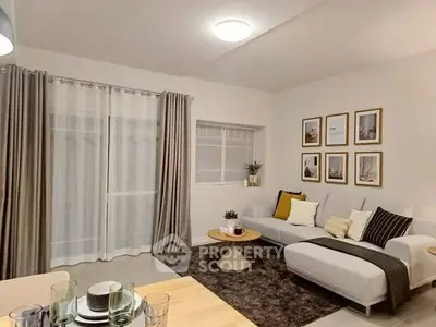 Modern living room with stylish decor and cozy seating area.