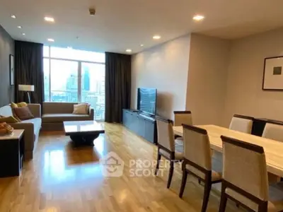 Spacious modern living room with dining area and city view