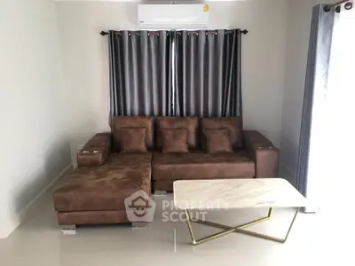 Modern living room with brown sectional sofa and marble coffee table
