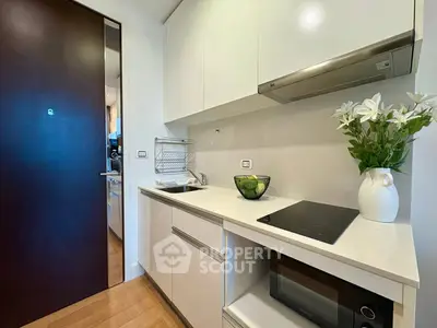 Modern compact kitchen with sleek design and integrated appliances