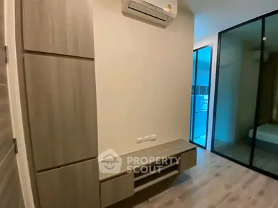 Modern bedroom with built-in storage and air conditioning