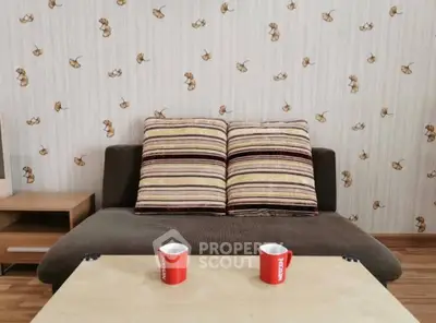 Cozy living room with stylish sofa and coffee table, perfect for relaxation.