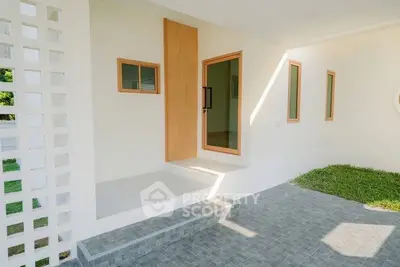 Modern minimalist home entrance with clean lines and natural light