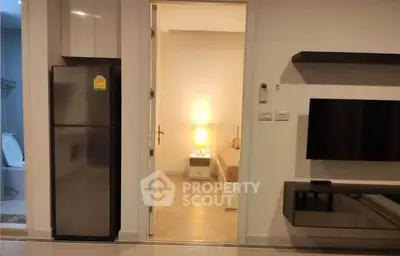 Modern apartment interior with sleek kitchen and cozy bedroom view