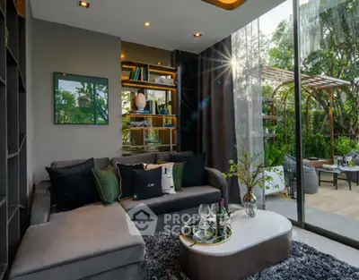 Luxurious living room with modern decor and garden view, perfect for relaxation and entertaining.