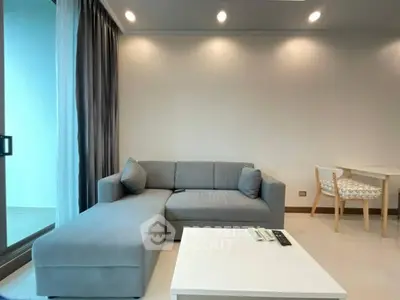 Modern living room with sleek gray sofa and elegant decor
