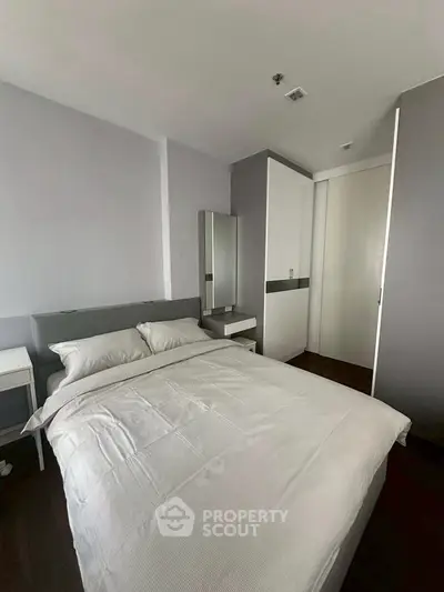 Modern bedroom with sleek design and ample storage space