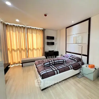 Spacious modern bedroom with stylish decor and natural light