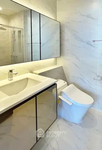 Modern bathroom with sleek fixtures and elegant marble tiles