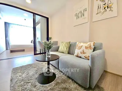 Modern living room with cozy sofa and stylish decor in open-plan apartment