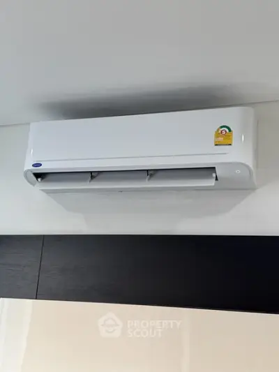 Modern air conditioning unit installed on a sleek interior wall, enhancing home comfort and energy efficiency.