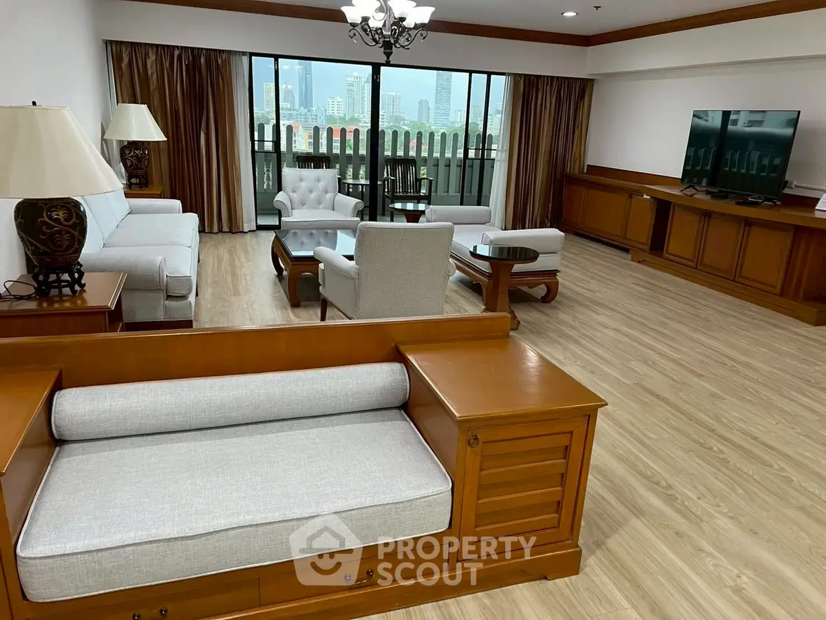 Spacious living room with elegant wooden furniture and city view, perfect for relaxation and entertainment.