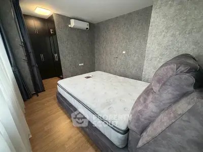 Modern bedroom with stylish decor and large comfortable bed in a cozy apartment.