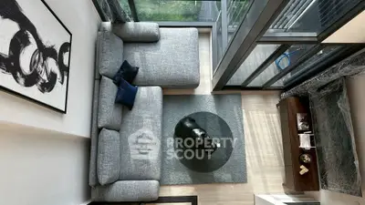 Modern living room with large windows and stylish decor