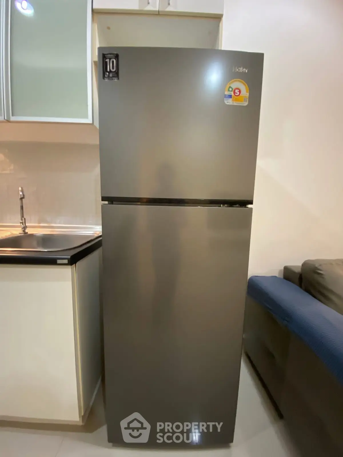 Modern kitchen with sleek refrigerator and stylish cabinetry