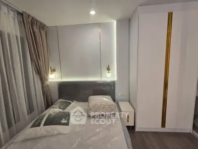 Modern bedroom with stylish lighting and sleek wardrobe design