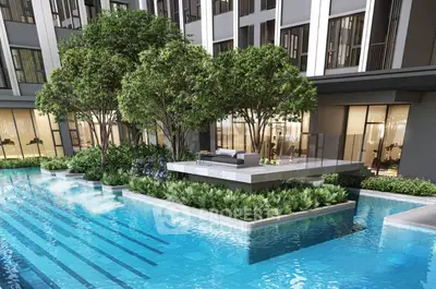 Luxurious apartment complex with stunning pool and lush greenery