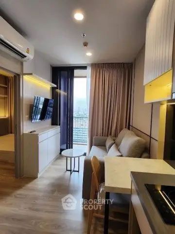 Modern living room with open kitchen and balcony view in stylish apartment