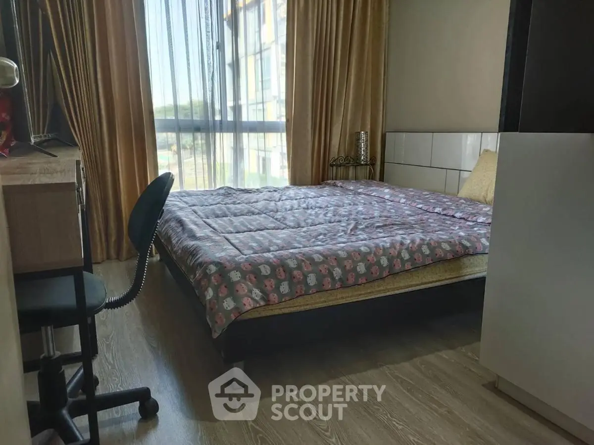 Cozy bedroom with large window and stylish decor