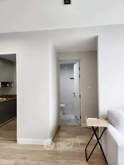 Modern apartment interior with sleek kitchen and cozy living area