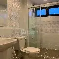 Modern bathroom with elegant tile design and glass shower enclosure